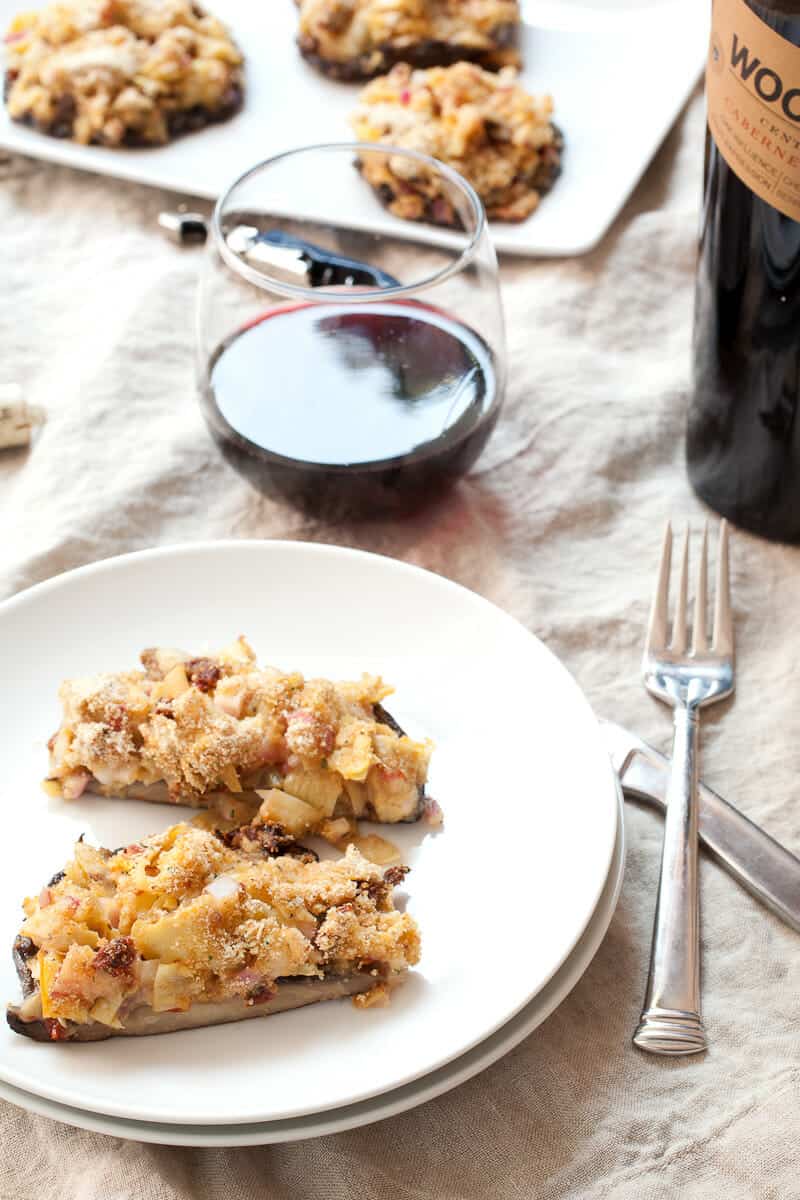 Artichoke Stuffed Mushrooms: Beautiful portobello mushrooms stuffed with sun-dried tomatoes, artichokes, and cheese. I like mine grilled! So perfect for a classy appetizer or even a light dinner. | macheesmo.com