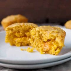 Cheddar Stuffed Corn Muffins: These delicious and savory corn muffins are stuffed with a huge chunk of cheddar cheese. It's like a little bonus when you break into the muffin. Good as a side dish for so many meals. It's the corn muffin you've been waiting for! | macheesmo.com