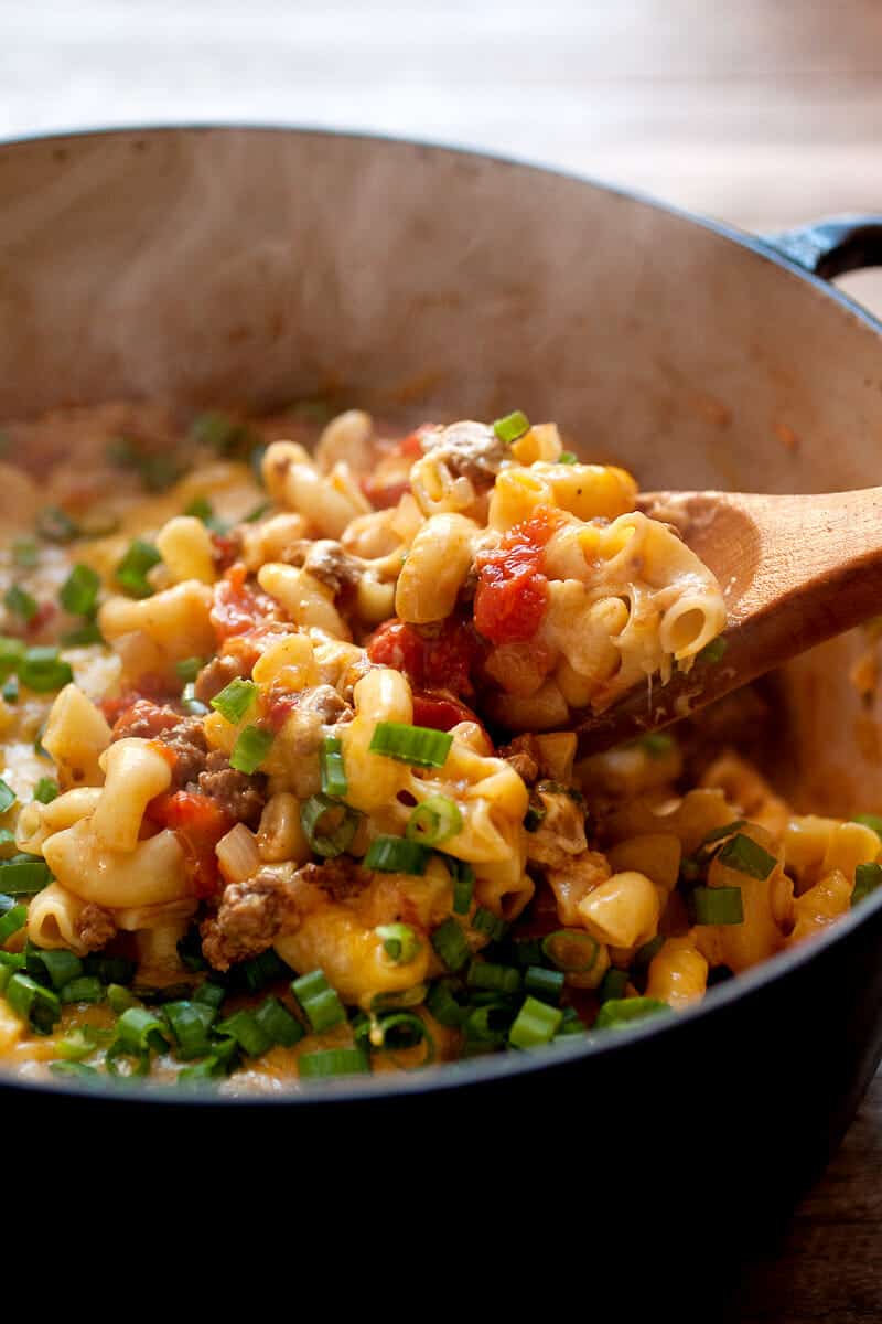 One Pot Cheeseburger Pasta: Everything cooked in one pot: beef, onions, and pasta! Some say it's impossible, but this is the way to make it happen! Plus, a nice little lid of cheddar cheese on top finishes off this pasta dish and makes it very worth your while. DIG IN. | macheesmo.com