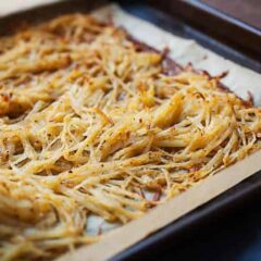 OC] The first shredded hash brown I have ever made. Two potatoes shredded  in a cheese grater, seasoned with garlic salt, cooked in the skillet and  then placed in the toaster oven