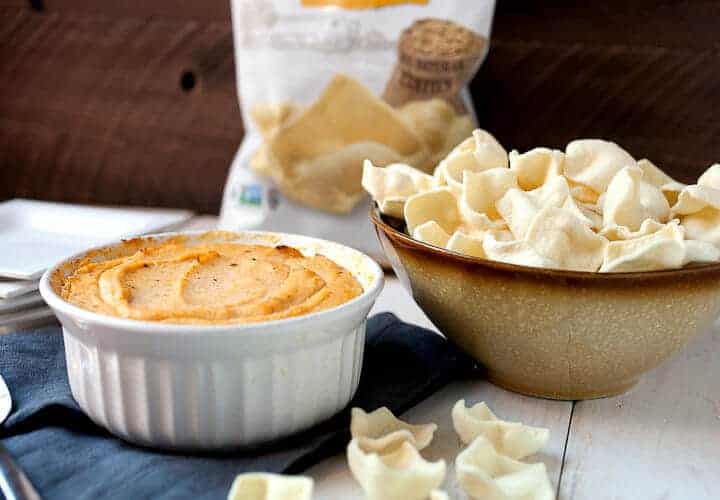 Spicy Cauliflower Dip: This healthy dip is a great substitution for a classic baked cheese dip. It has just enough sharp cheddar and is loaded with pureed cauliflower and delicious spices. I like to serve mine with Simply7 Lentil chips! #sponsored | macheesmo.com