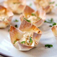 Hot Crab Dip Wonton Cups: These are the most addictive little bites you'll find on an appetizer table. Hot crab dip spiced with Old Bay seasoning, shallot, and just a dash of hot sauce. Baked right into a crispy wonton cup! | macheesmo.com