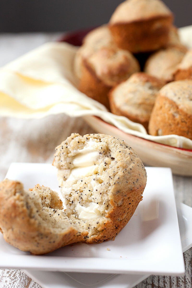 Banana Poppy Seed Muffins: These easy muffins are half banana bread and half poppy seed muffin. They don't need as much sugar as some muffins because of the ripe bananas. They are perfectly fluffy and great with a little butter. Kids love them! | macheesmo.com