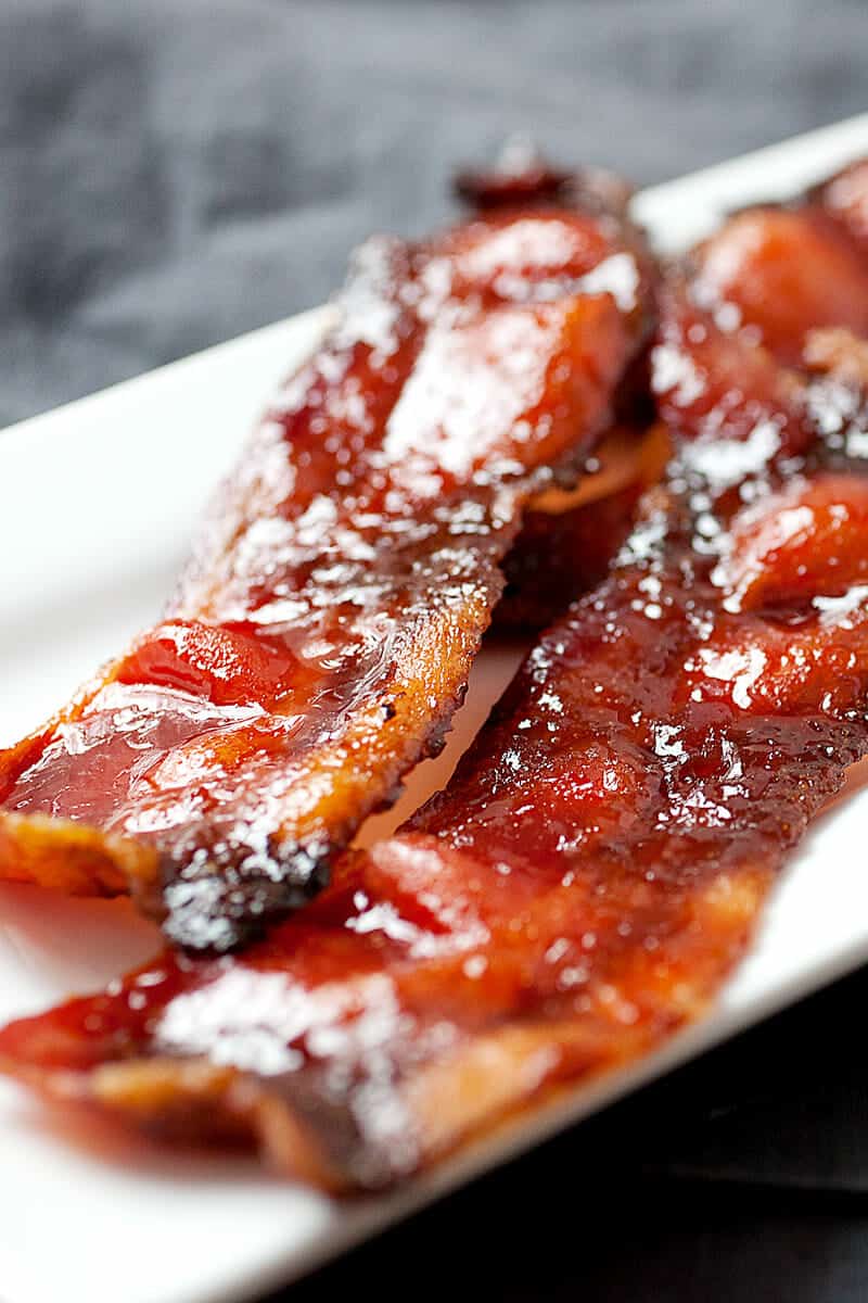 Sriracha Candied Bacon: This is a super-simple twist on bacon that will hit all the right tastebuds. Slightly sweet and spicy, this is bacon at its best! | macheesmo.com