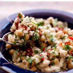 Easy and Fresh Falafel Salad: All the ingredients of a traditional falafel tossed in a quick and fresh salad! Chickpeas, bulgar, loads of herbs, and fresh, crunchy veggies plus a simple Tahini dressing. Great side dish or light lunch! | macheesmo.com