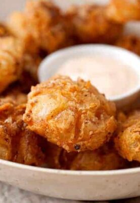 Bited Sized Blooming Onions: The perfect bite-sized version of the popular fried onion appetizer! Easy to share and easy to eat! So delicious and crispy with a soft slightly sweet and tangy bite. So good!