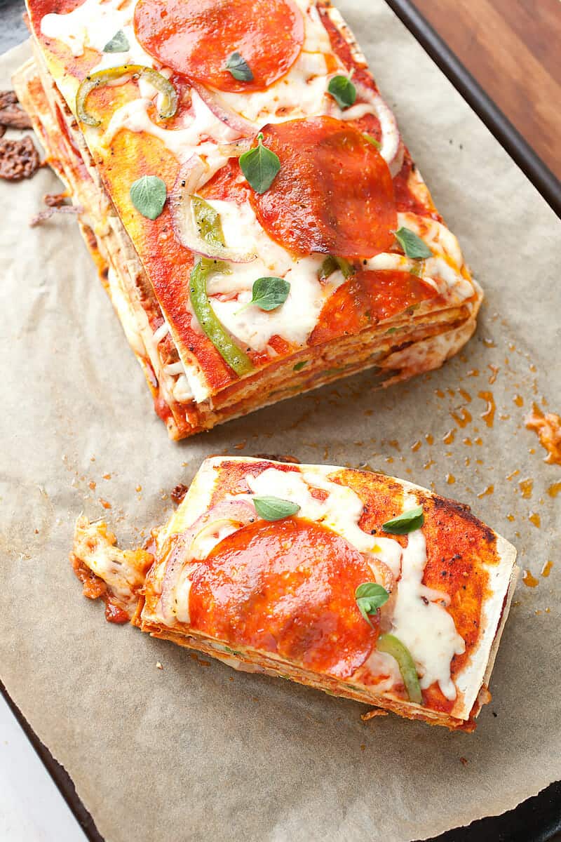 Pepperoni Pizza Stack: The key to this beautiful and delicious creature is to use thin crusts so the finished stack isn't too dough-filled! Layers of cheese, pepperoni, peppers, and onions makes for one delicious stack. I like to use Flatout Flatbread Artisan Thin Crust Pizza Crusts for my layers! #sponsored | macheesmo.com