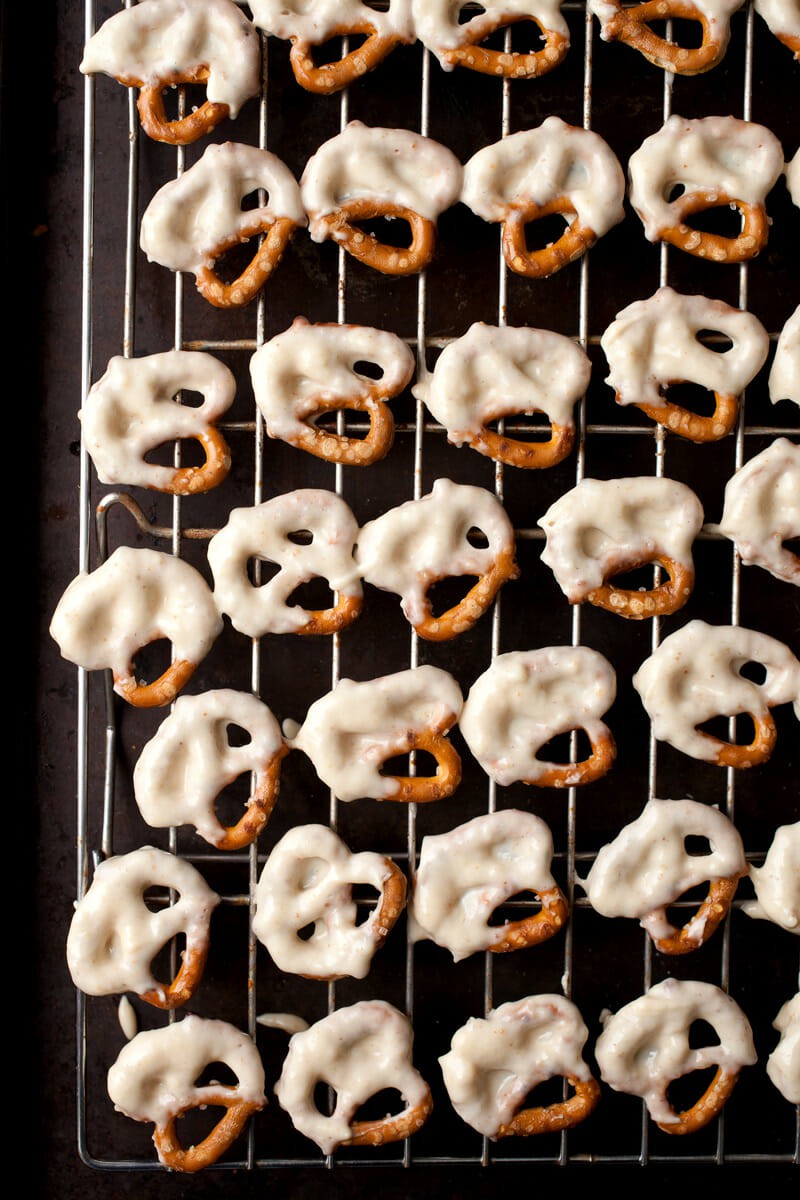 Freezing the yogurt dip onto pretzels.