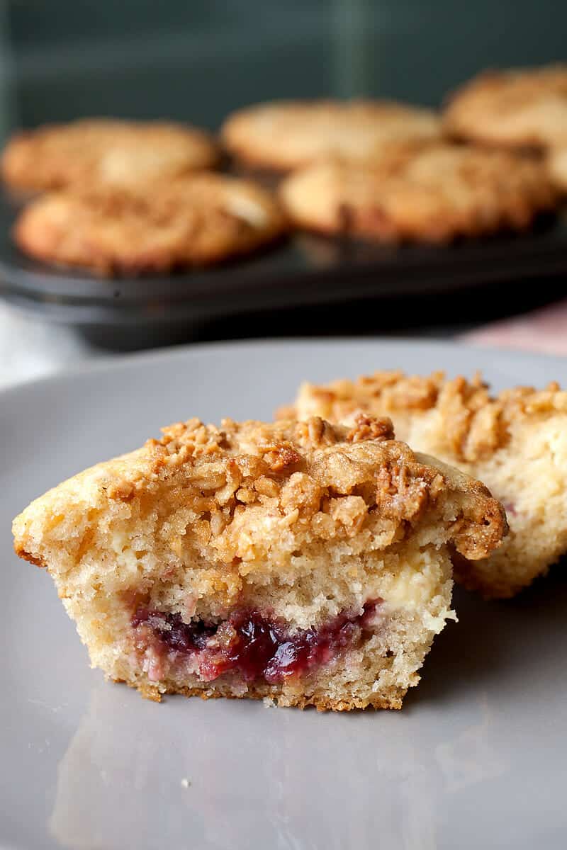 Cream Cheese and Jam Muffins: After many attempts, this is the way to stuff a muffin with just enough cream cheese and fruit jam. The finished muffin is sweet, tangy, and crunchy on top thanks to some granola streusel. A huge success! | macheesmo.com