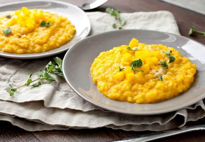 Creamy Golden Risotto: This colorful bright risotto is mixed with beets and carrots. The root veggies give the risotto a nice sweetness and beautiful color. How could you not want a big bowl of this stuff?! | macheesmo.com