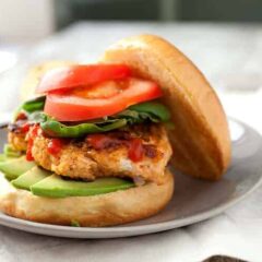 Sriracha Chicken Burgers: I call these my rooster chicken burgers thanks to rooster (Sriracha) sauce! It's mixed in with the burger and added on top also. This is not your standard bland chicken burger. Spice it up! | macheesmo.com