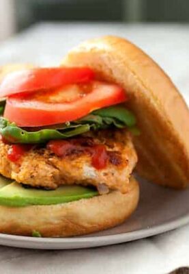 Sriracha Chicken Burgers: I call these my rooster chicken burgers thanks to rooster (Sriracha) sauce! It's mixed in with the burger and added on top also. This is not your standard bland chicken burger. Spice it up! | macheesmo.com
