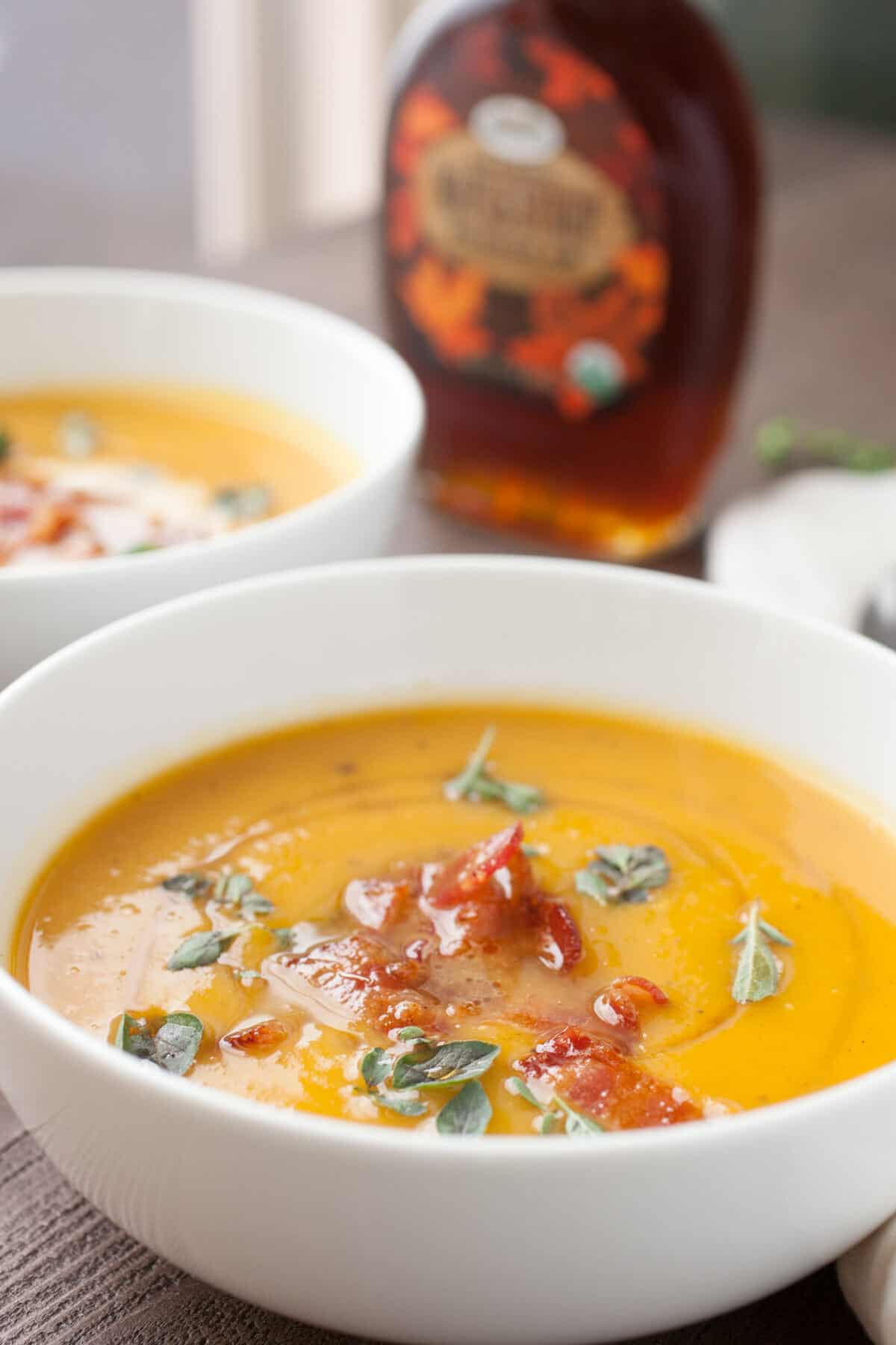 Butternut Squash Soup with Maple Bacon: Say hello to fall with this delicious roasted squash soup. The soup itself is really easy but gets a nice crunch and sweetness from crumbled maple bacon on top! YUM! | macheesmo.com