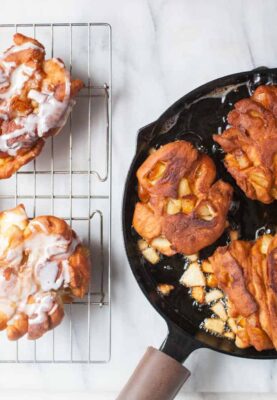 Cast Iron Homemade Apple Fritters: Soft homemade donut dough folded with apples and spices and fried in a cast iron skillet for a crispy exterior crust. Comfort food at its best. | macheesmo.com