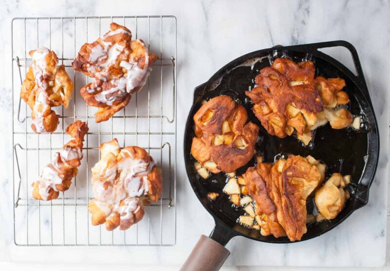 Cast Iron Homemade Apple Fritters: Soft homemade donut dough folded with apples and spices and fried in a cast iron skillet for a crispy exterior crust. Comfort food at its best. | macheesmo.com