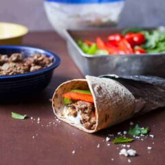 Lamb Gyro Flatbread Wraps: Savory ground lamb served with a labneh tzatziki sauce and fresh veggies in a Flatbread wrap. One of my new favorite wraps, for sure! | Macheesmo.com