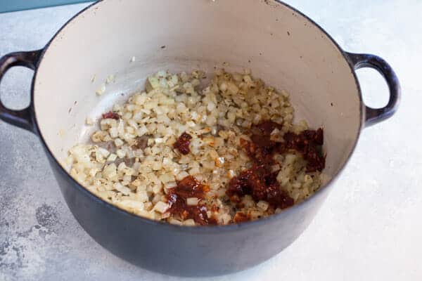 Cooking onions and spices for tortilla soup.