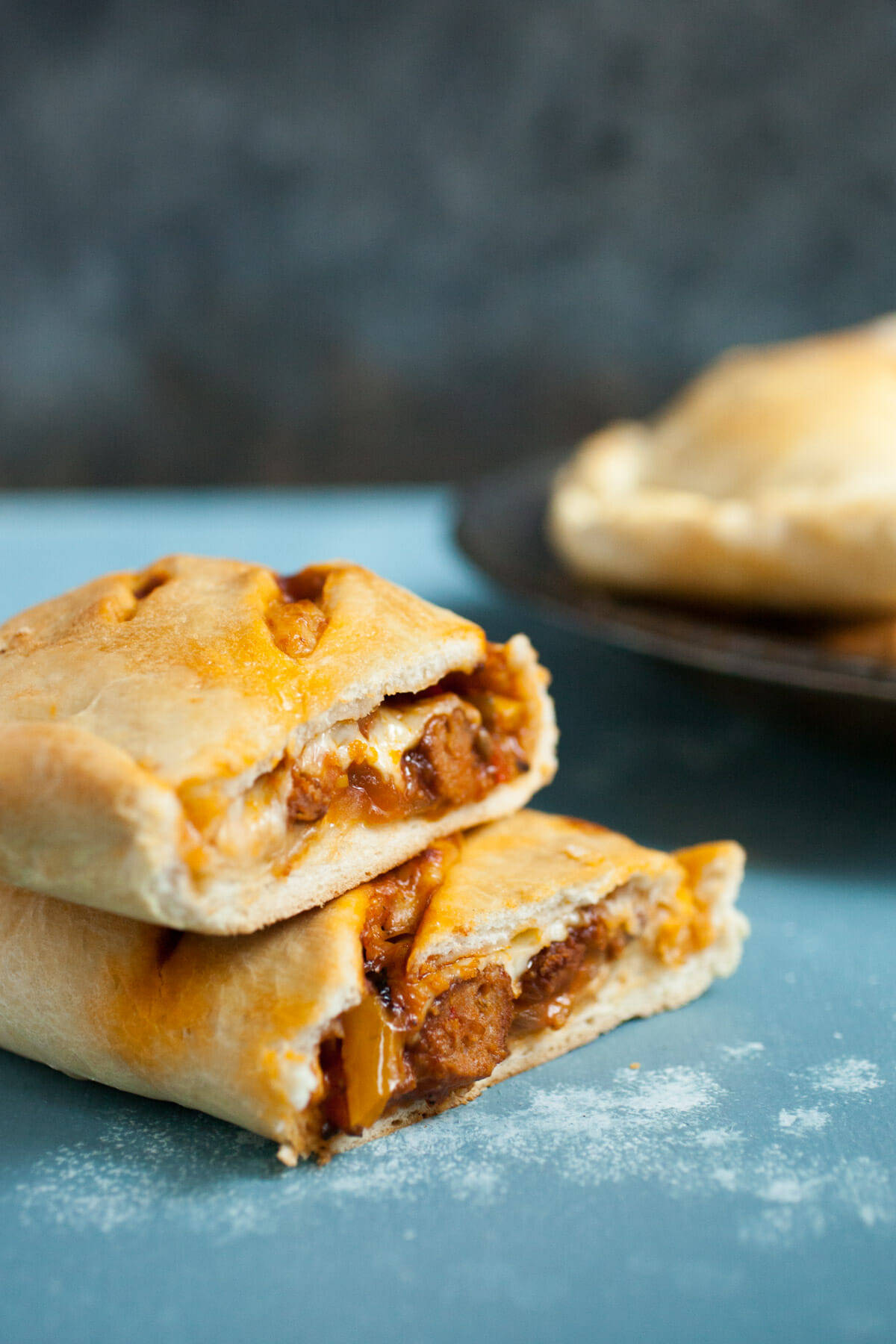 Sausage and Pepper Hot Pockets: These delicious homemade hot pockets are stuffed to the max with sausage, peppers, and cheese. They freeze perfectly as well and make for quick meals whenever you need one! | macheesmo.com