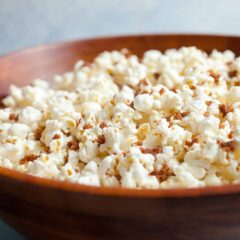 Bacon Dust Popcorn: A bacon lover's dream. This popcorn is coated with big spoonfuls of what I call bacon dust. Dried and ground bacon bits with salt and sugar mixed in. It's a perfect snack topper. Enjoy! | macheesmo.com