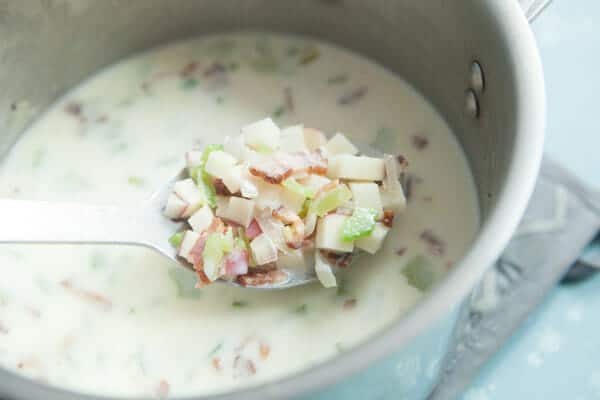 Simmering the potatoes in the salmon chowder.