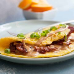 Peanut Butter Omelet with Candied Bacon: This might sound crazy, but with a few tips and tricks this omelet is ridiculously delicious. The key is some perfectly candied bacon! You gotta try this! | macheesmo.com