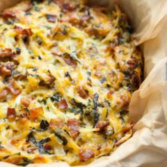 Potato Breakfast Pie with Bacon and Kale: An all-in one Brunch masterpiece, this pie is everything you want in a breakfast dish. Shredded potatoes, bacon, veggies, and just enough cheese and egg to hold it together. Make it, eat it, freeze any leftovers! | macheesmo.com