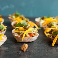 Seven Layer Wonton Cups: These are the perfect tex-mex appetizer for any party. Easy to make and really fun. Your guests will love these! | macheesmo.com