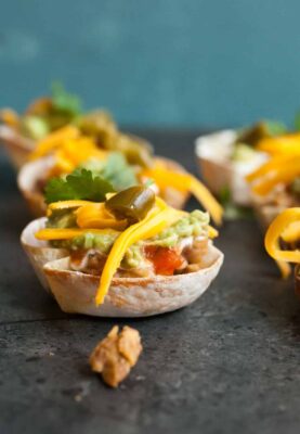 Seven Layer Wonton Cups: These are the perfect tex-mex appetizer for any party. Easy to make and really fun. Your guests will love these! | macheesmo.com