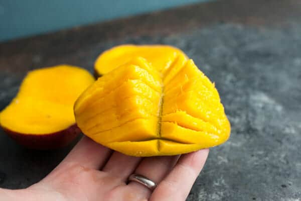 Slicing the mango for a grilled cheese filling.