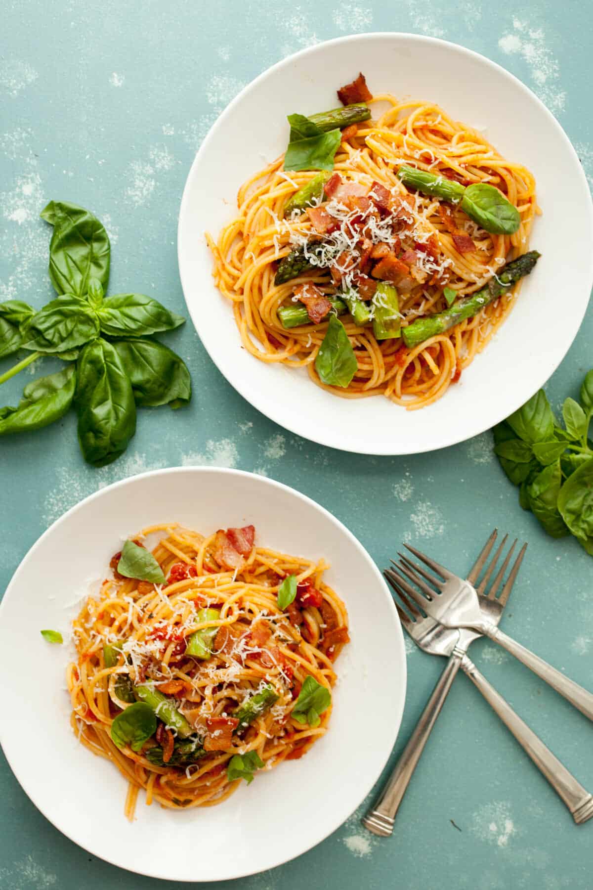 Bacon Asparagus Spaghetti: Perfect spring asparagus cooked with bacon a homemade tomato sauce and tossed with spaghetti! I love this Italian recipe! | macheesmo.com