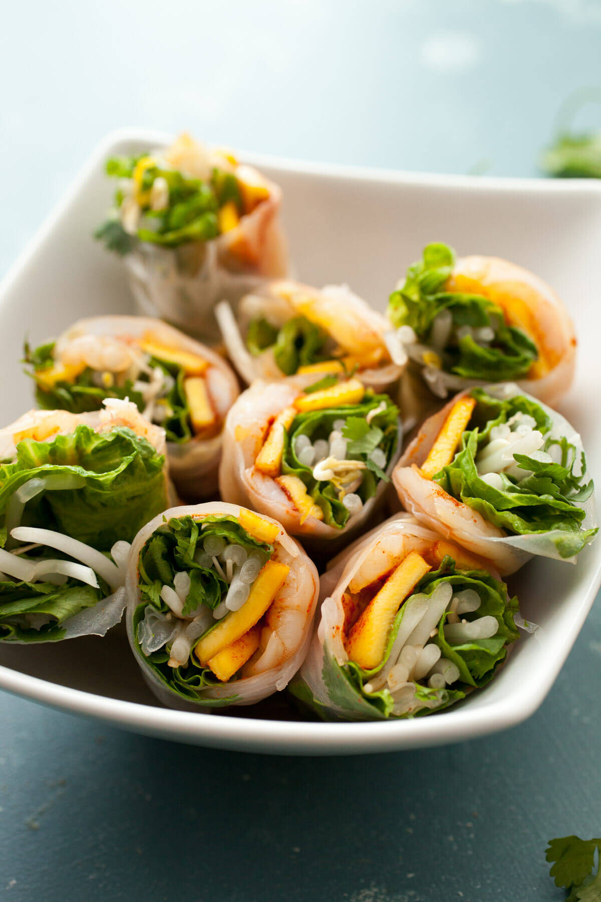 Chili Mango Shrimp Spring Rolls: These light and refreshing spring rolls are the perfect way to beat the summer heat. Serve them as a hearty appetizer or a lighter meal! | macheesmo.com