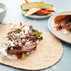 Grilled Greek Steak Wraps: Marinated and grilled skirt steak with loads of grilled veggies and a quick tzatziki sauce. A hearty and delicious wrap! | macheesmo.com