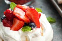 These mini pavlovas might just be the perfect dessert for a hot summer day. Light and refreshing and easy-to-make with a simple berry topping!