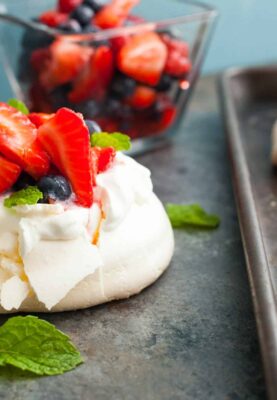 These mini pavlovas might just be the perfect dessert for a hot summer day. Light and refreshing and easy-to-make with a simple berry topping!