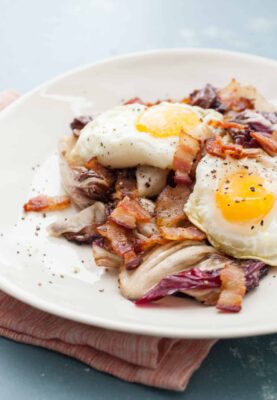 Grilled Radicchio Salad: This unassuming salad is jam-packed with flavor thanks to a bacon vinaigrette and some crispy eggs on top. YUM! | macheesmo.com