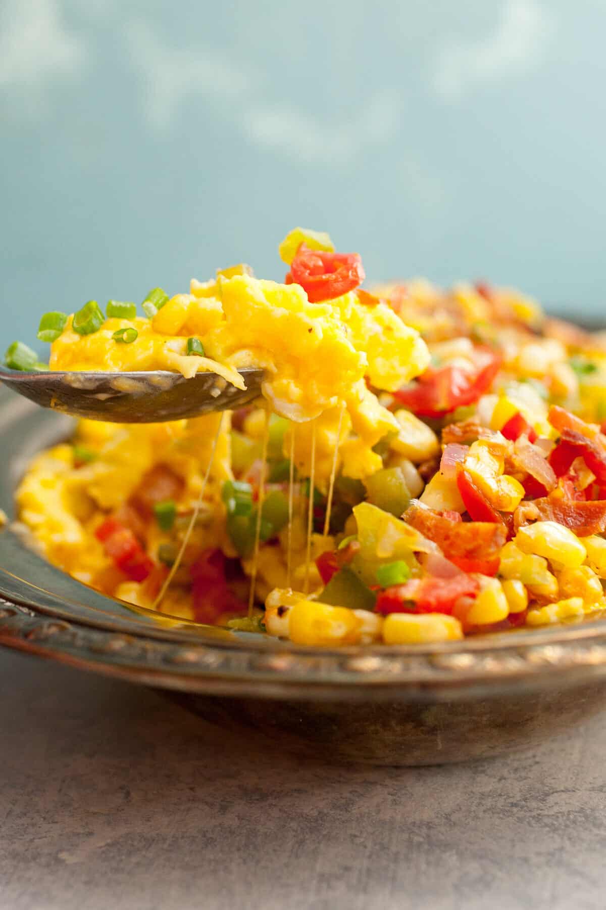 Loaded Scrambled Eggs: For the indecisive breakfast lover. This is too much filling to make an omelet with so I just piled it high and called it LOADED. A delicious breakfast, no doubt. | macheesmo.com