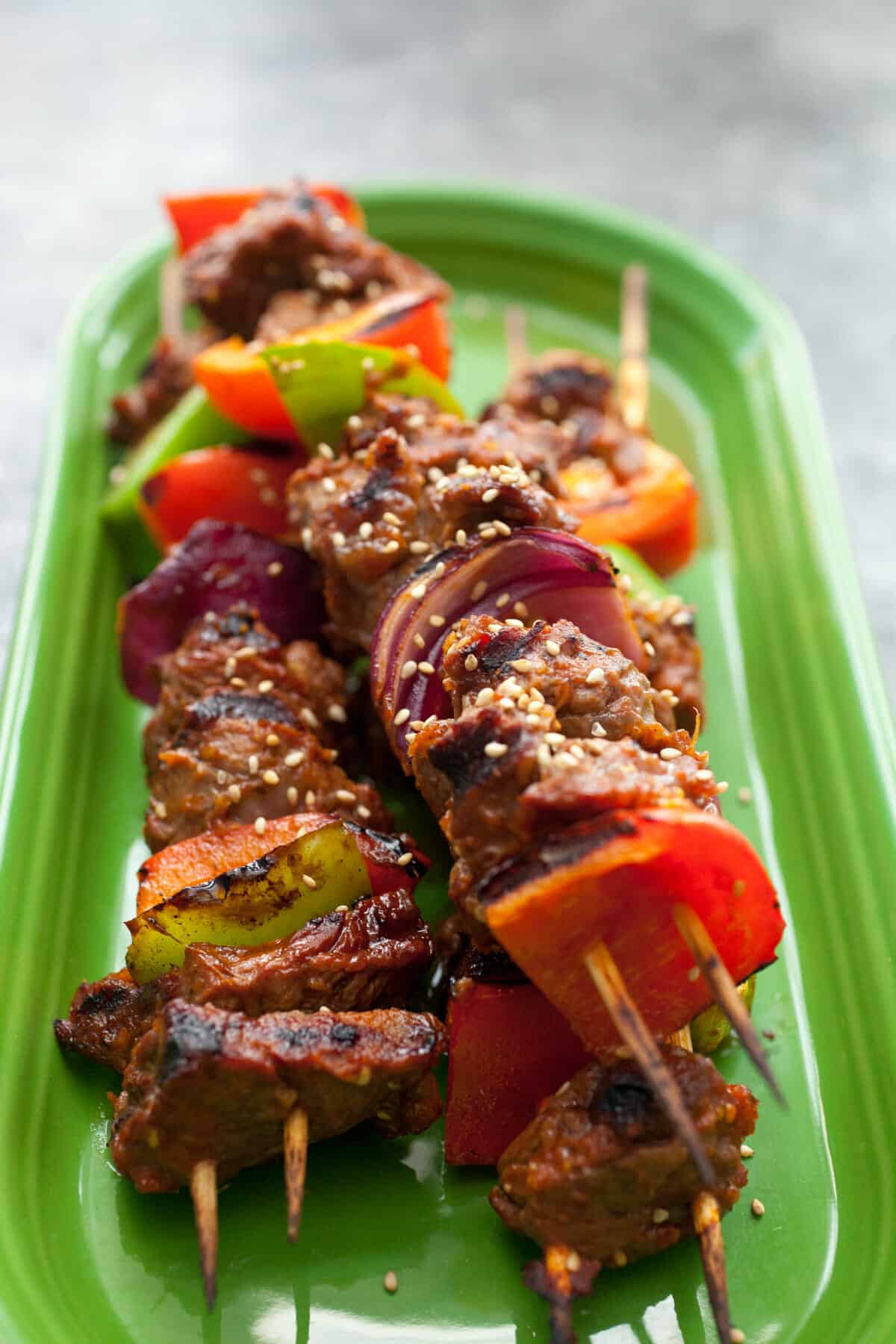 Bulgogi Steak Kabobs: These easy steak kabobs have a delicious marinade and are the perfect thing to toss on your grill for a lazy BBQ party! | macheesmo.com
