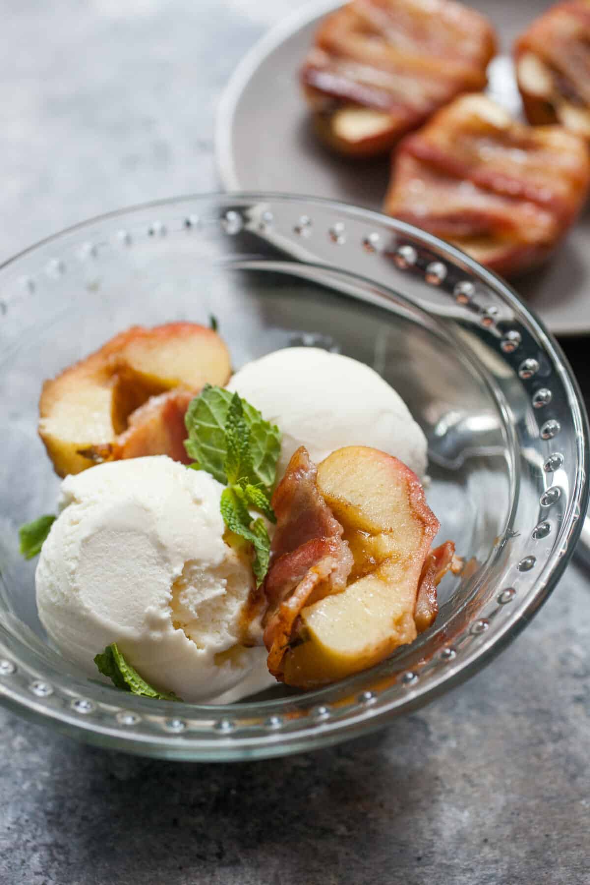 Bacon Wrapped Baked Apples: A slightly savory twist on dessert. Apples stuffed with brown sugar and spices and baked wrapped with bacon. HINT: Serve it with ice cream. YUP. | macheesmo.com