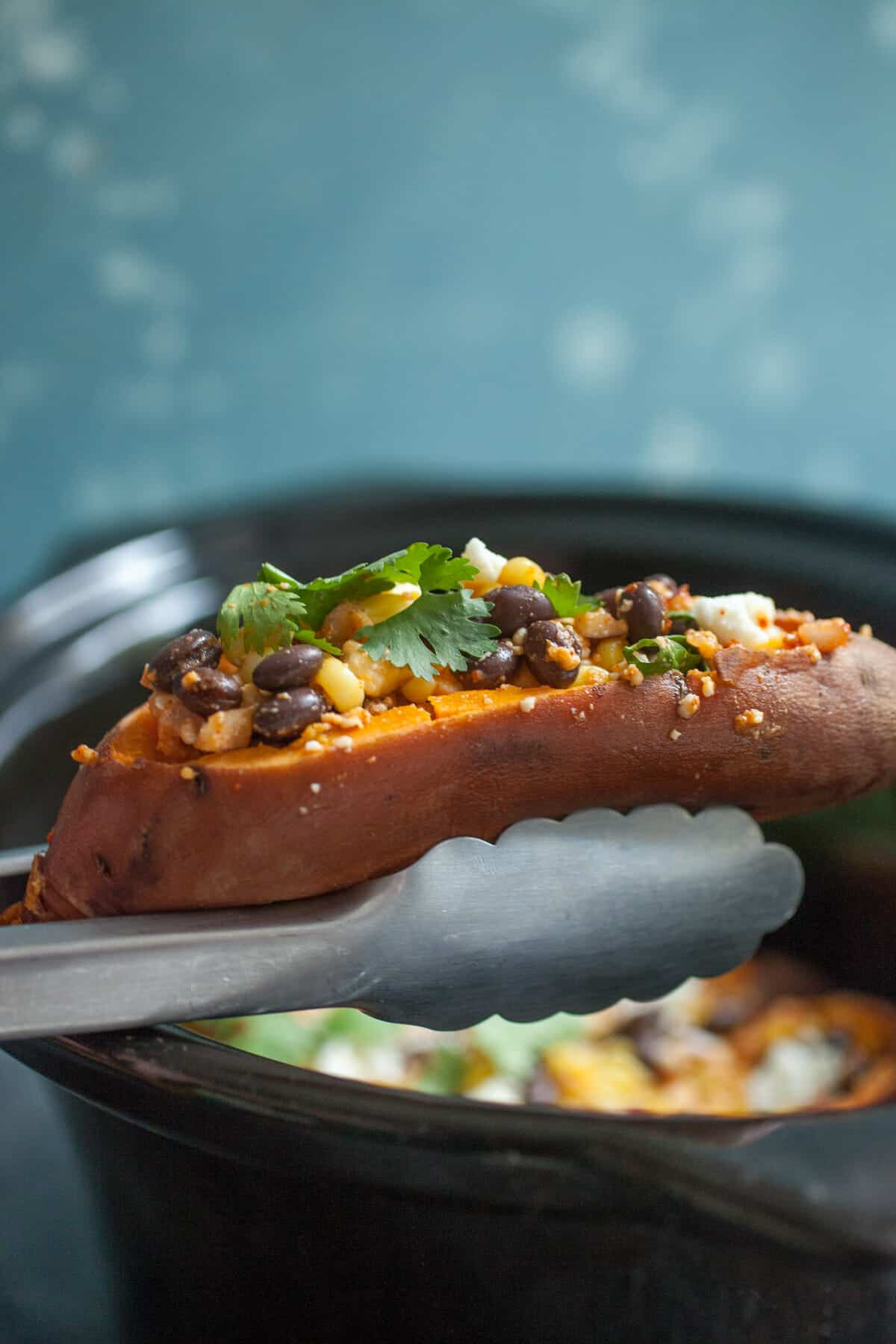 Stuffed Tex Mex Slow Cooker Sweet Potatoes: These sweet potatoes are the perfect mix of spicy, sweet, and savory and you can practically set them and forget them! A great vegetarian friendly meal! | macheesmo.com