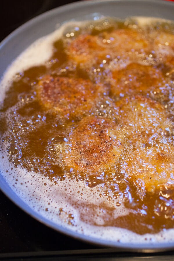 Frying green tomatoes.
