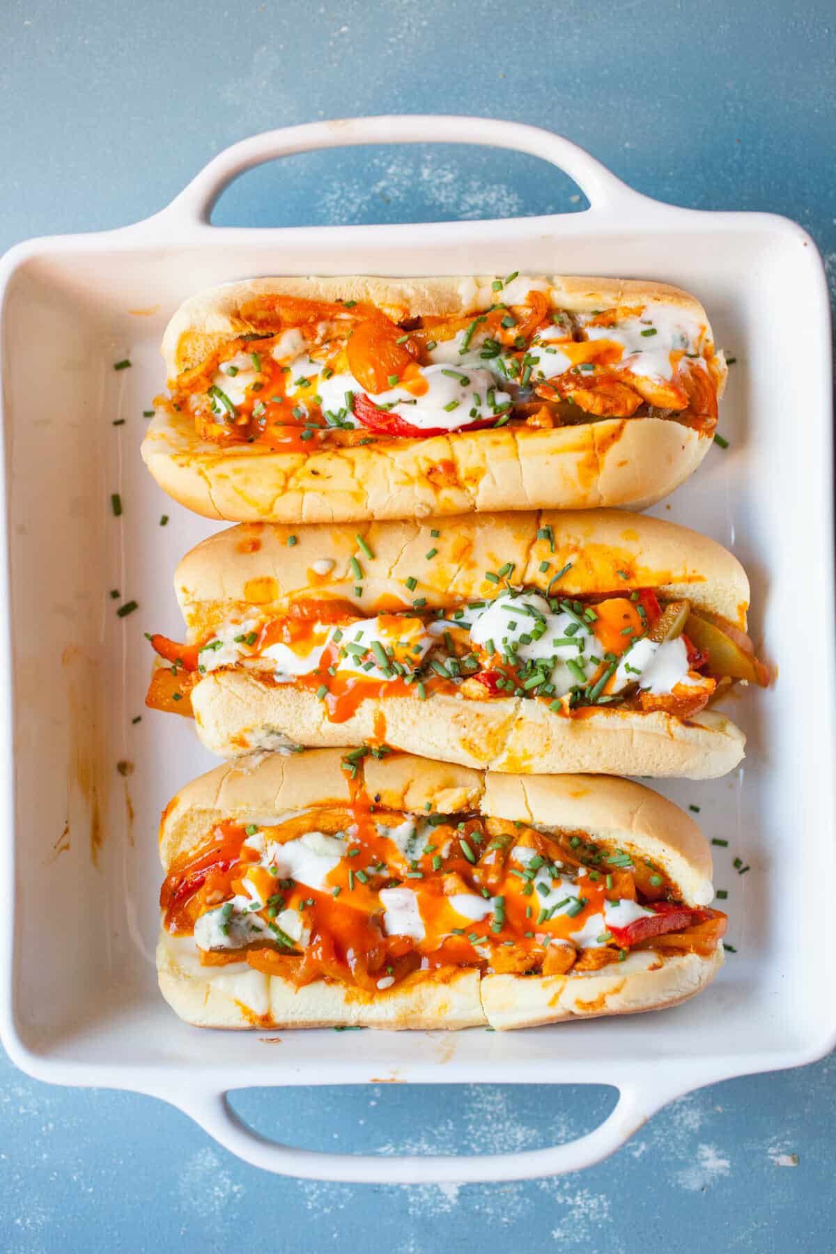 Buffalo Chicken subs in a baking dish.