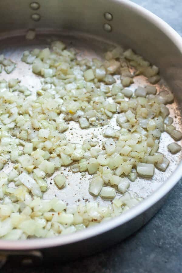 Cooking onions in a skillet.