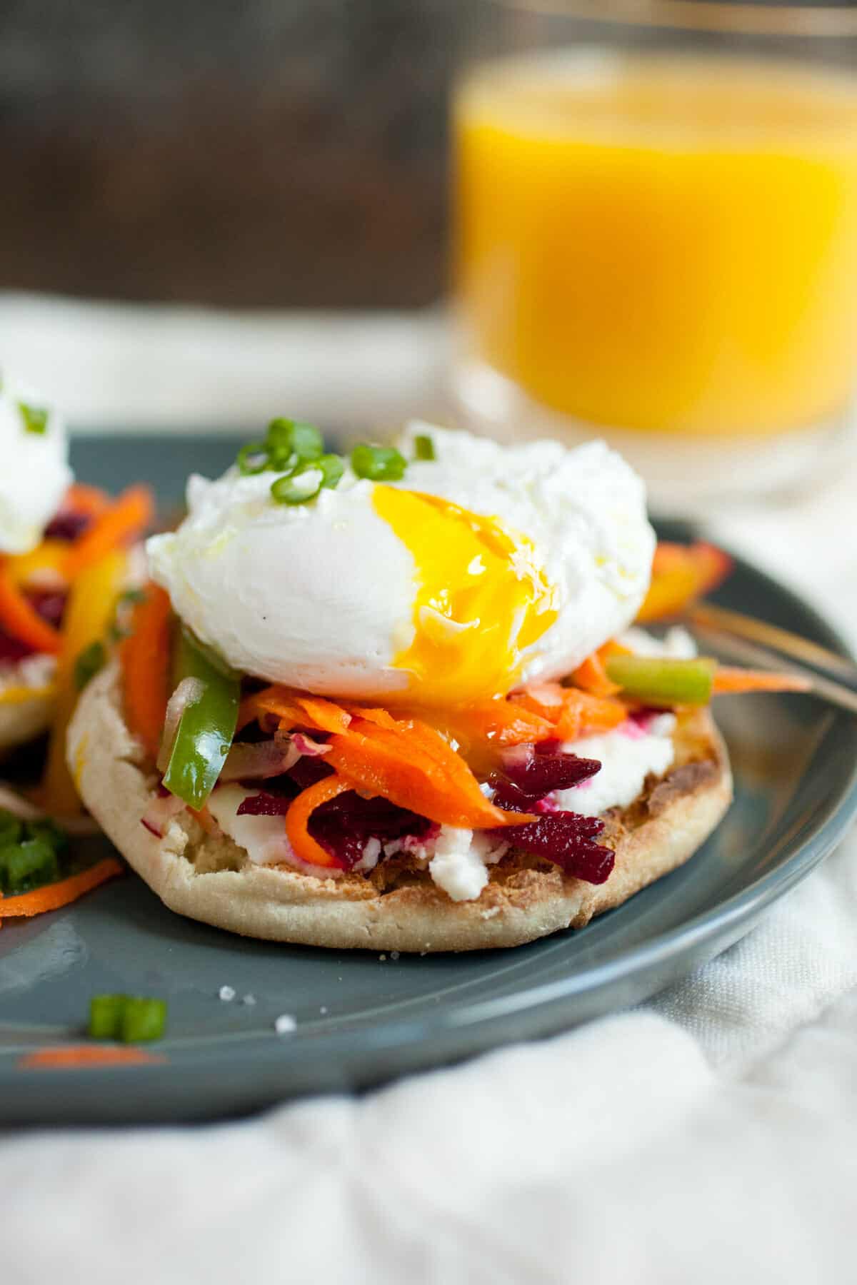 Ricotta Rainbow Veggie Toasts: These simple breakfast toasts are topped with loads of colorful veggies and perfect poached eggs for an easy and elegant way to start the day! | macheesmo.com