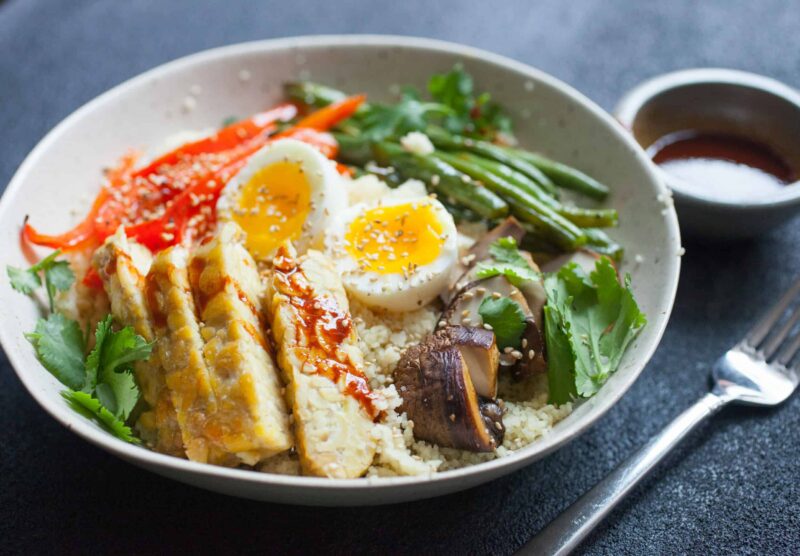 Sheet Pan Tempeh Buddha Bowls: Delicious bowls with almost every topping baked on one sheet pan for easy prep! Plus an egg and quick spicy sauce. YUM! | macheesmo.com