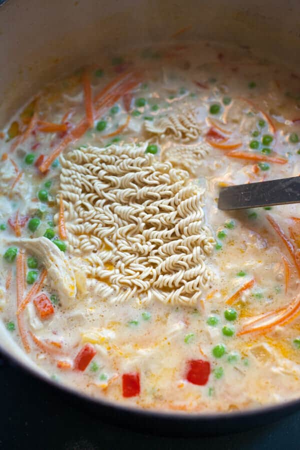 Ramen Noodles cooking in Chicken Ramen Soup