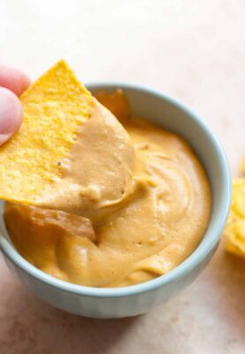 Nooch Sauce: A beautiful creamy and savory sauce made with nutritional yeast and a few other delicious add-ins. Perfect for SO many uses. I like it on burgers, with chips, or on veggies! | macheesmo.com