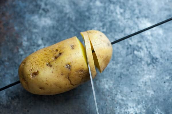 Starting the spiral potato on a skewer.