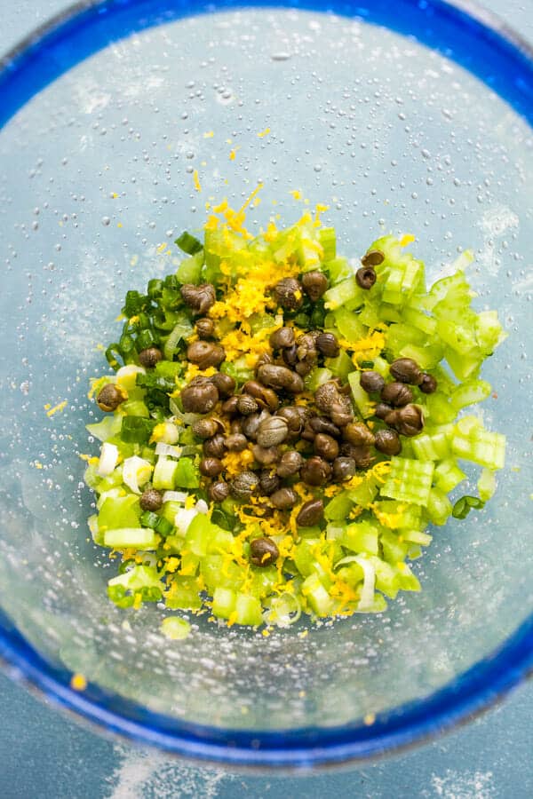 Add-ins for tuna salad in a bowl.