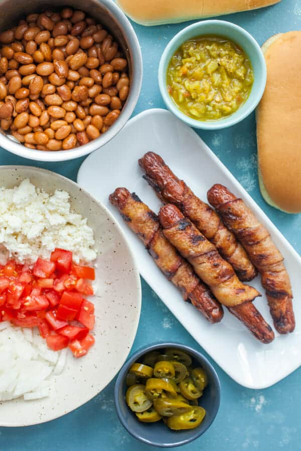 All the toppings laid out for Sonoran Hot Dogs