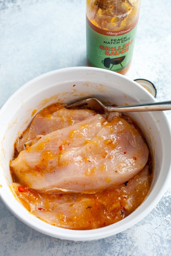 Marinating the chicken for sandwiches.